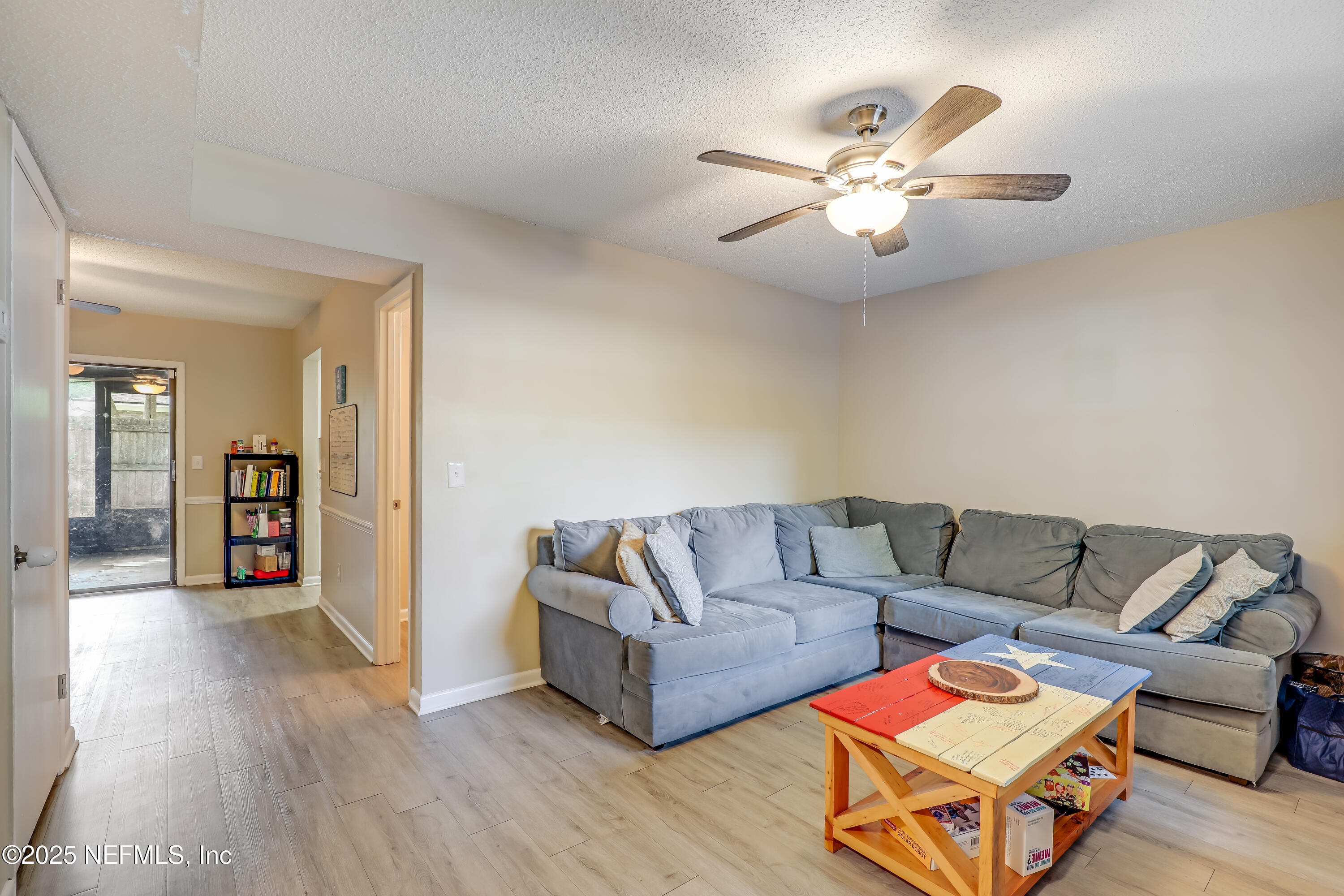 503 Kettering Way Orange Park, FL 32073 - Photo 8 of 28 a living room with furniture and wooden floor