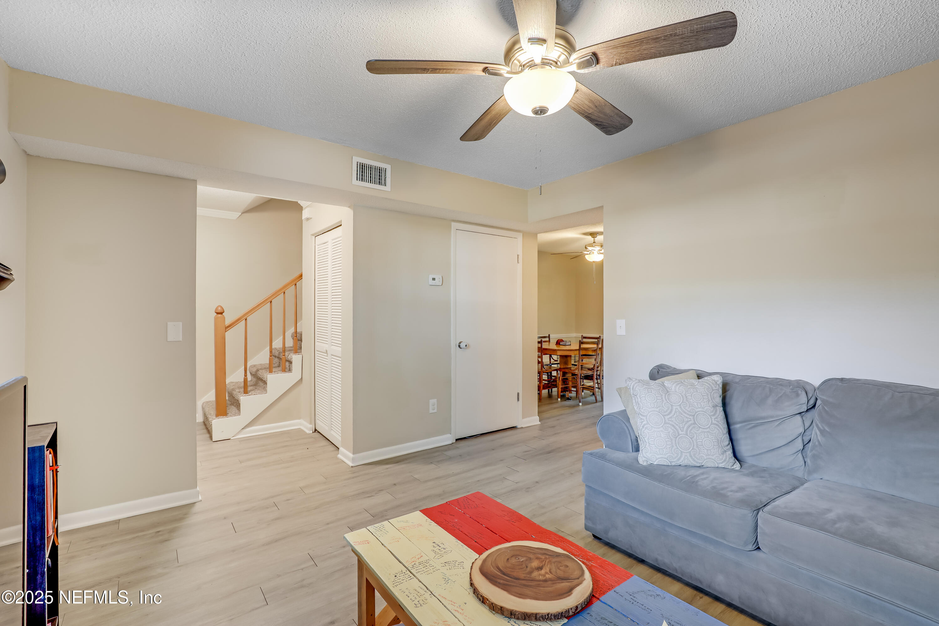 503 Kettering Way Orange Park, FL 32073 - Photo 9 of 28 a living room with furniture and a chandelier