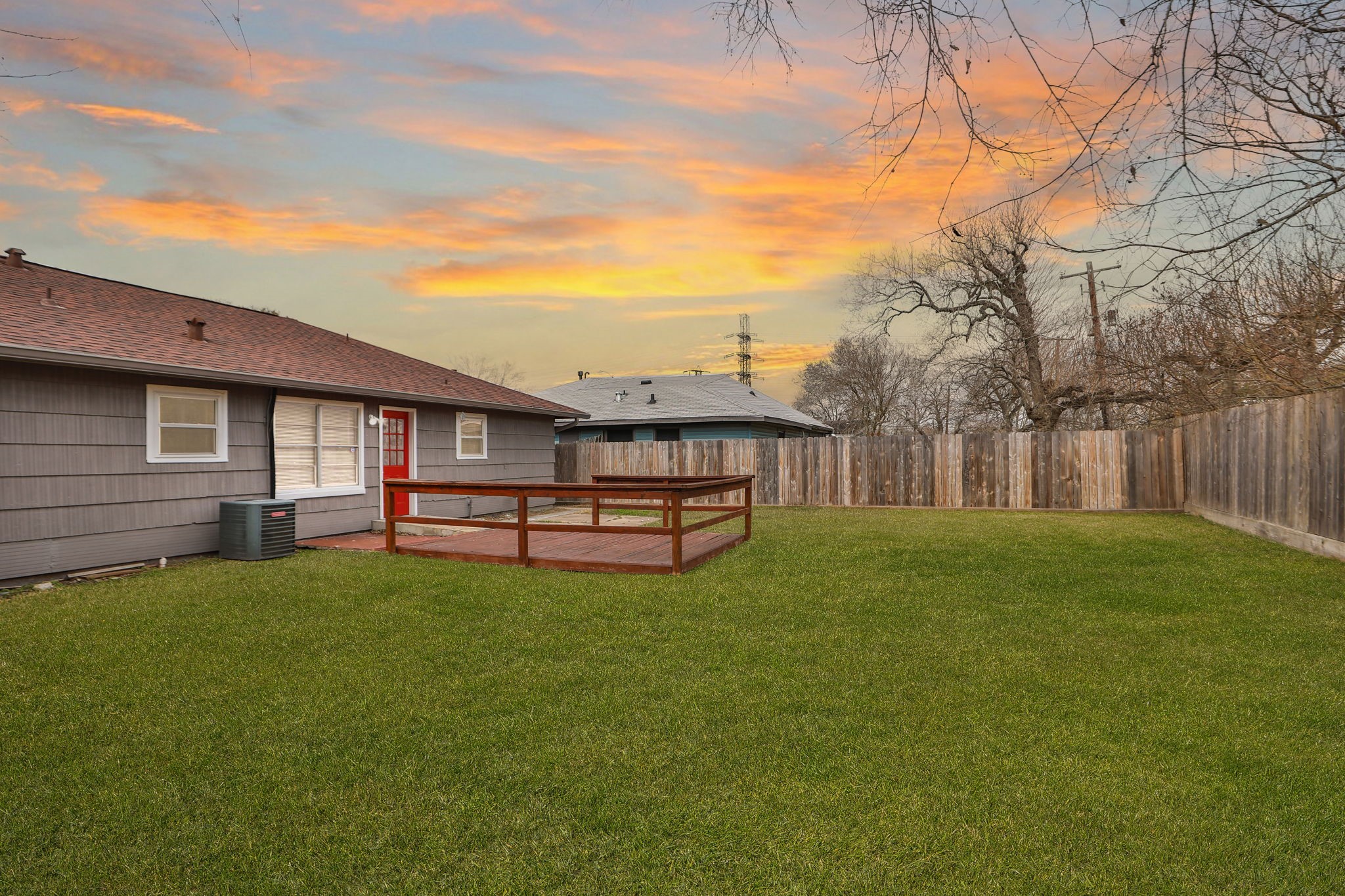 9211 Vinearbor Street Houston, TX 77033 - Photo 29 of 33 a view of a house with a backyard and wooden fence