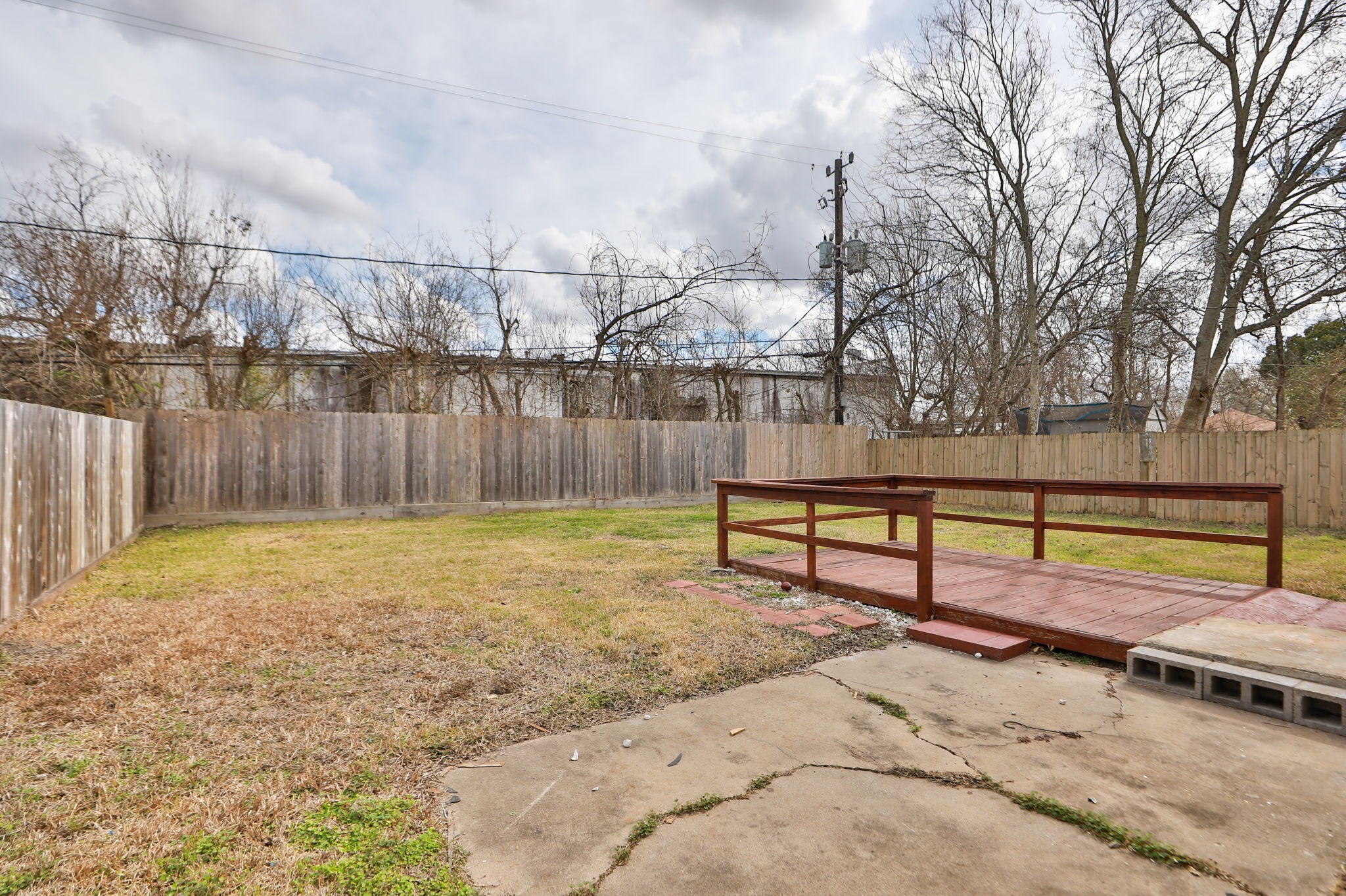 9211 Vinearbor Street Houston, TX 77033 - Photo 30 of 33 a view of backyard with wooden fence