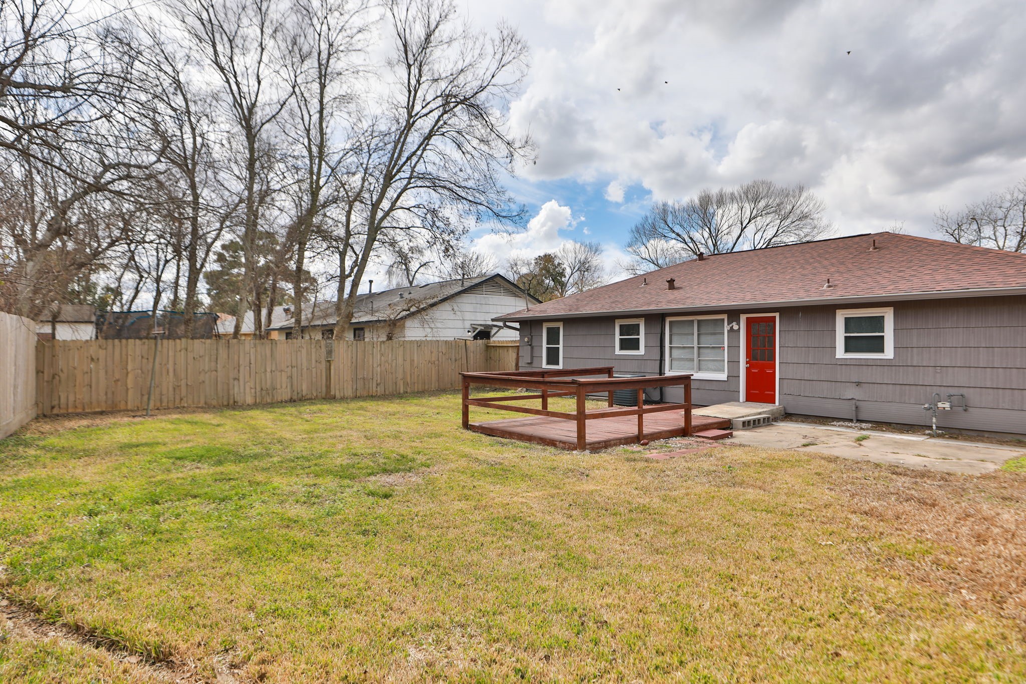 9211 Vinearbor Street Houston, TX 77033 - Photo 31 of 33 a view of a house with backyard and a tree