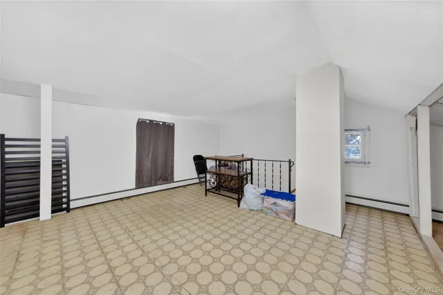 a an empty room with furniture and wooden floor