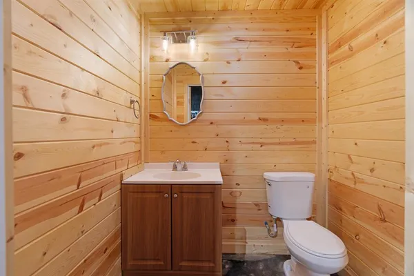 a bathroom with a toilet and a sink