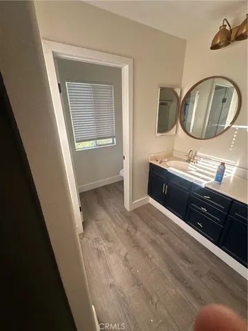 a room with a mirror and a sink
