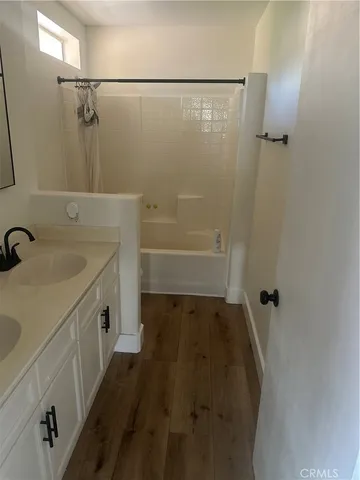 a bathroom with a sink and shower