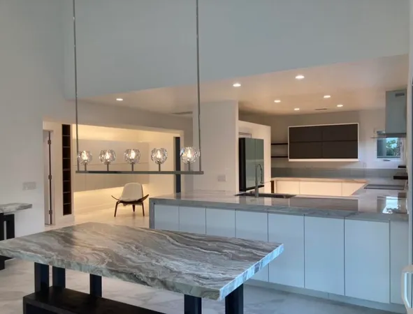 a kitchen with a table and chairs in it