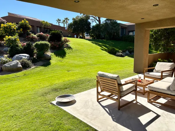 a view of a table and chairs in the patio