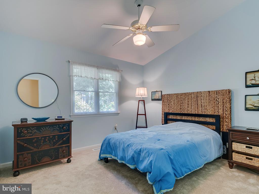 32 Harpoon Road Ocean Pines, MD 21811 - Photo 14 of 37 a bed sitting in a bedroom next to a window