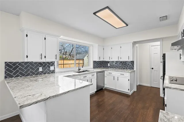 a kitchen with a sink stove and refrigerator