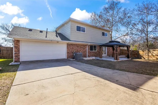 a front view of a house with yard