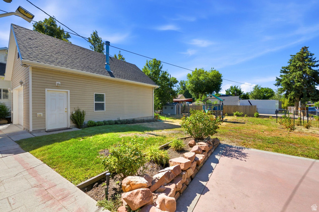 310 East 600 South Centerville, UT 84014 - Photo 26 of 41 Detached structure featuring light-colored siding and a dark shingle roof