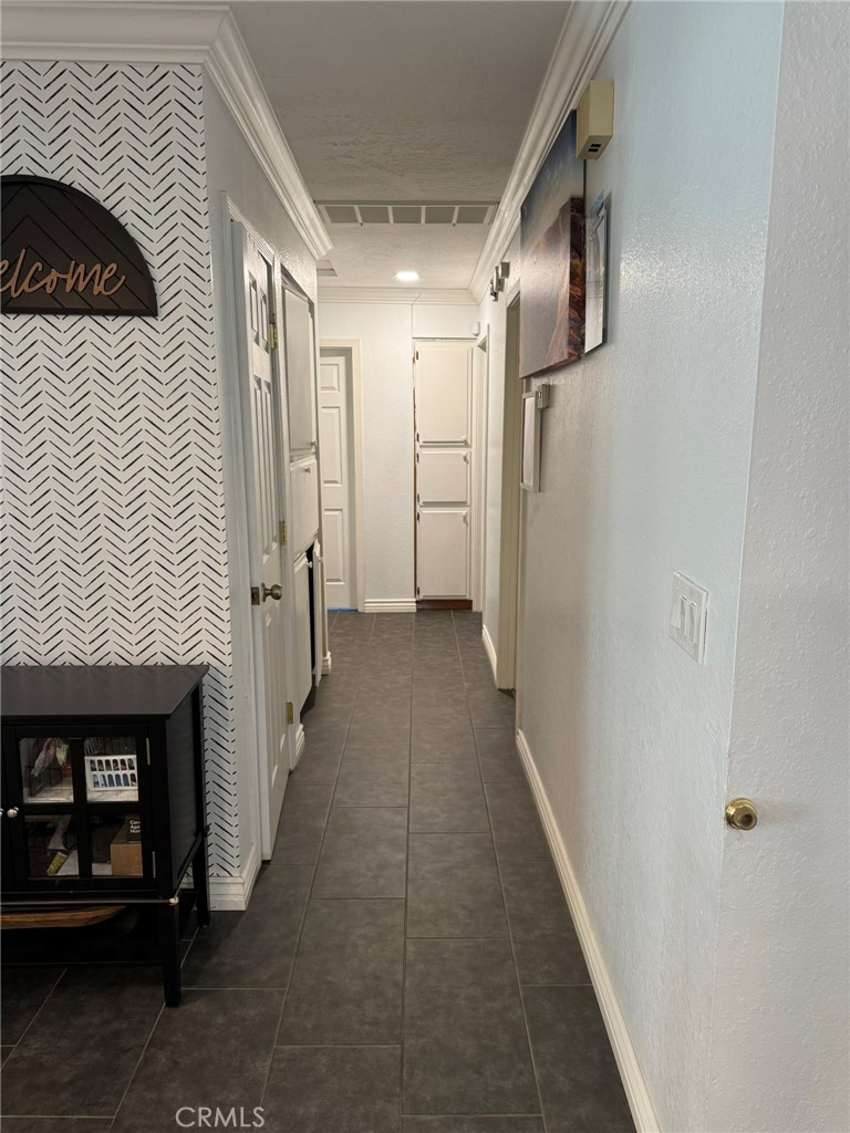 13771 Wawona Road Apple Valley, CA 92307 - Photo 13 of 30 a view of a hallway with wooden floor and staircase