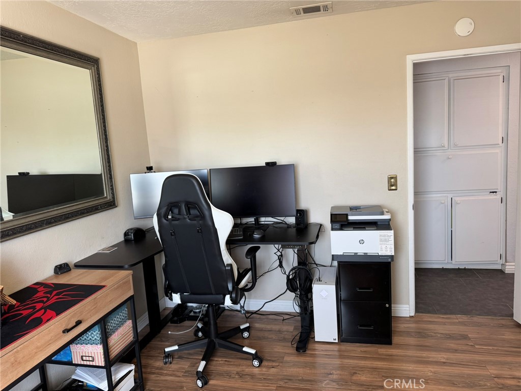 13771 Wawona Road Apple Valley, CA 92307 - Photo 17 of 30 a view of workspace with wooden floor windows