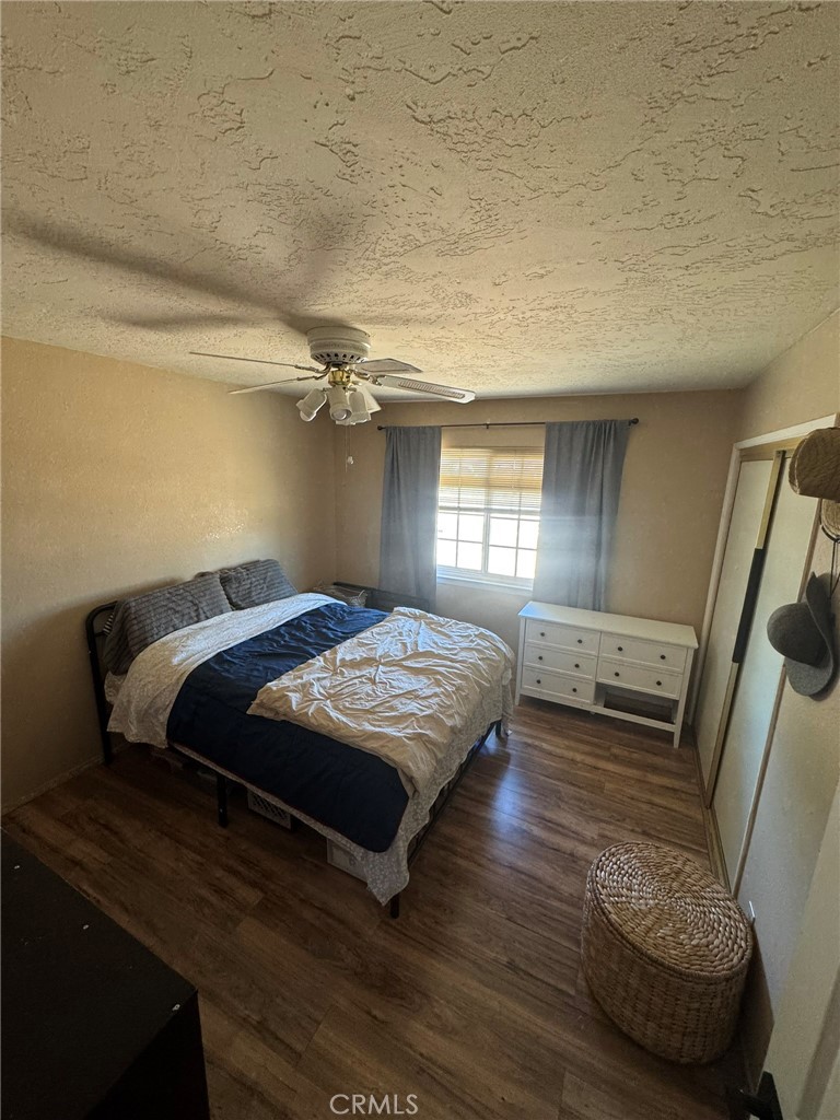 13771 Wawona Road Apple Valley, CA 92307 - Photo 19 of 30 a bedroom with a bed and a large window