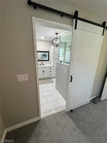 a bathroom with a sink a mirror and a shower