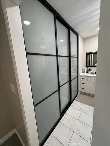 a bathroom with double vanity sink and mirror