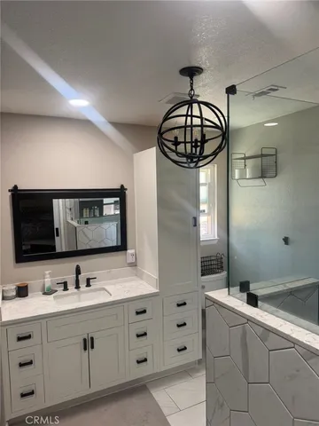 a kitchen with counter top space cabinets and stainless steel appliances