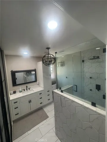 a large bathroom with a double vanity sink and a mirror