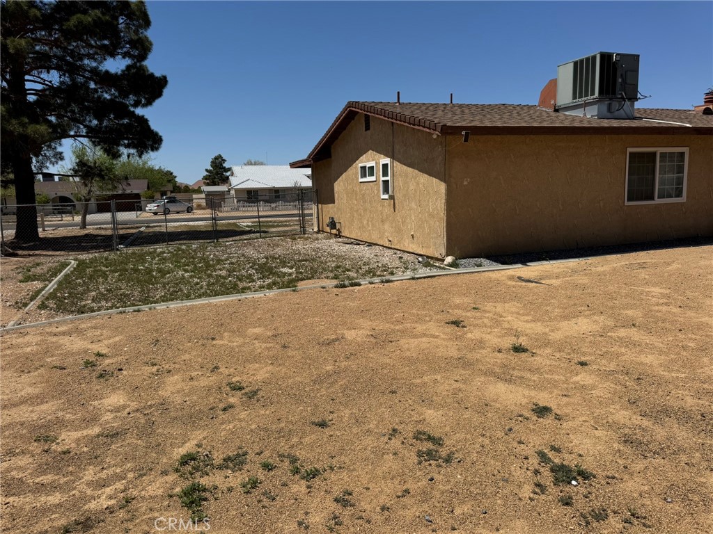 13771 Wawona Road Apple Valley, CA 92307 - Photo 28 of 30 a front view of a house with a yard