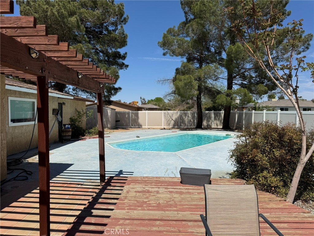 13771 Wawona Road Apple Valley, CA 92307 - Photo 30 of 30 a front view of a house with garden