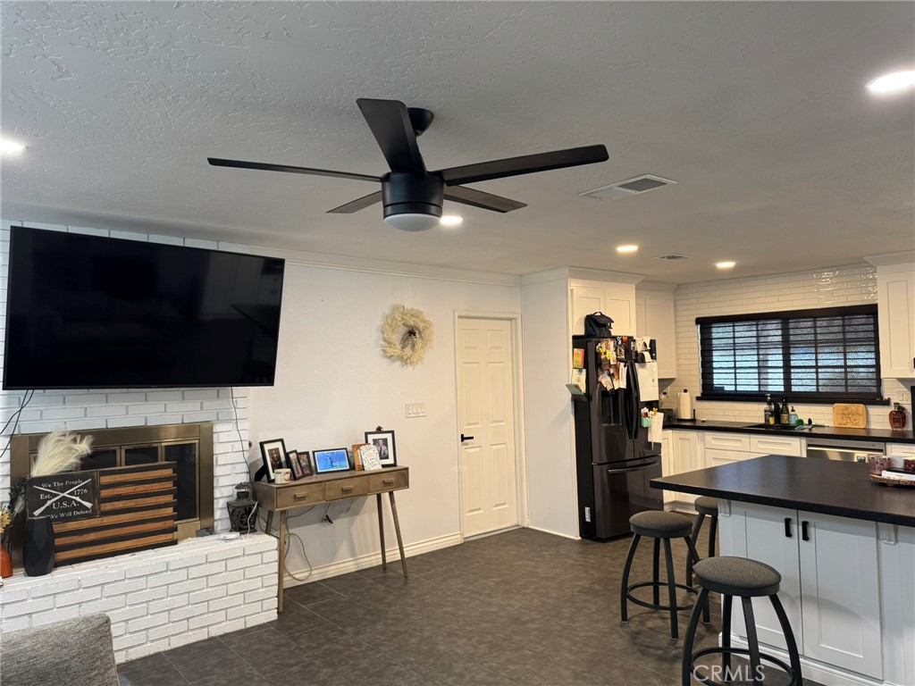 13771 Wawona Road Apple Valley, CA 92307 - Photo 5 of 30 a living room with furniture and a flat screen tv