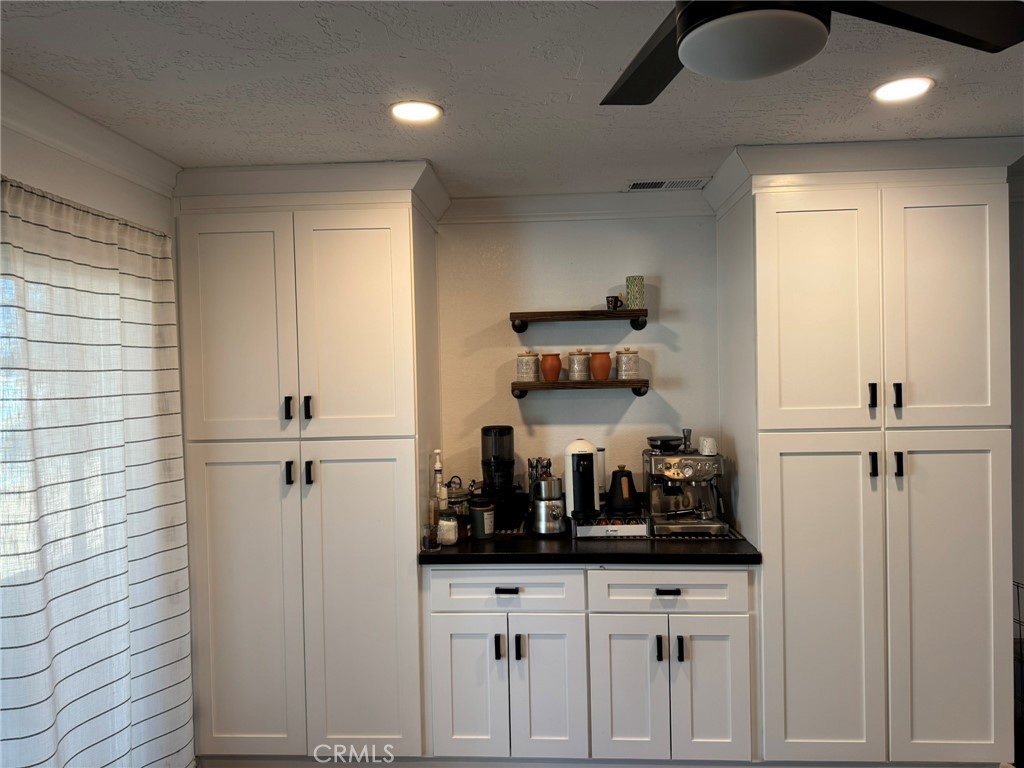 13771 Wawona Road Apple Valley, CA 92307 - Photo 6 of 30 a kitchen with a refrigerator and cabinets