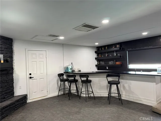 a kitchen with a table and chairs in it