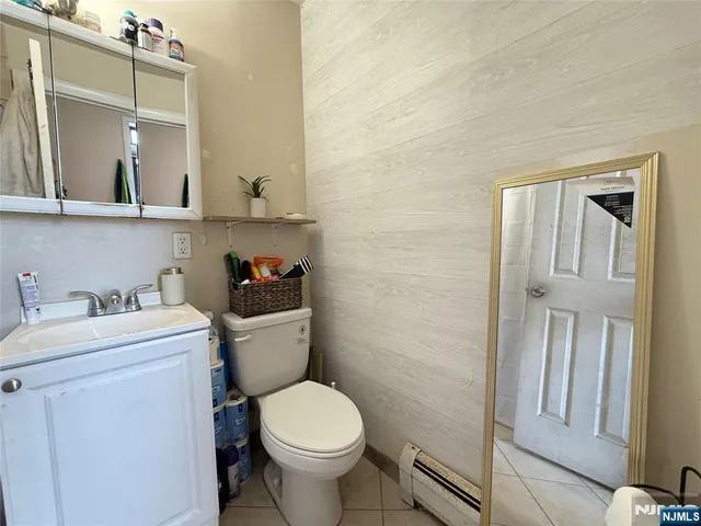 a bathroom with a sink a toilet and vanity