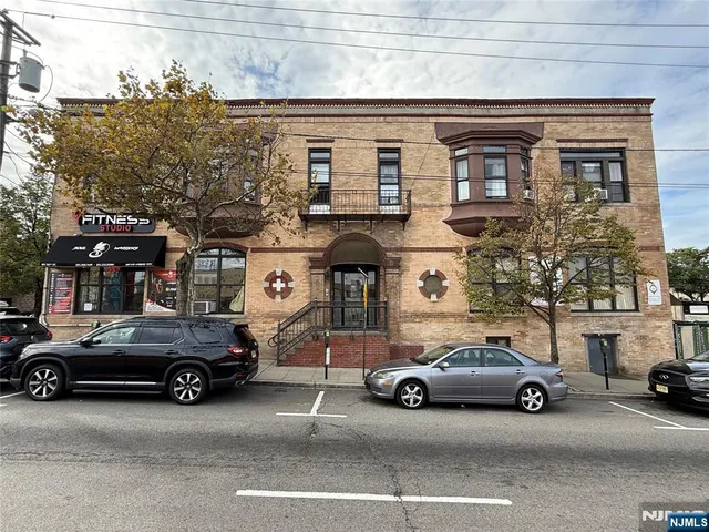 a view of a cars parked in front of a house