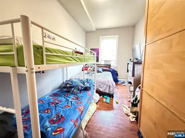 a bed room with furniture and a window