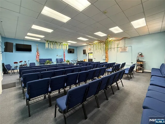 a large kitchen with a table and chairs