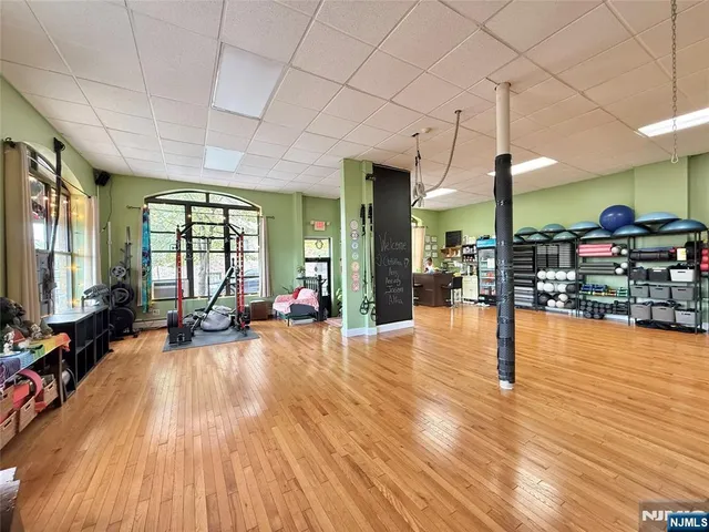 a view of a living room and hall with wooden floor
