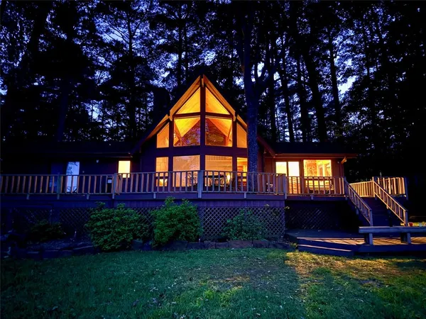 a view of house with a yard