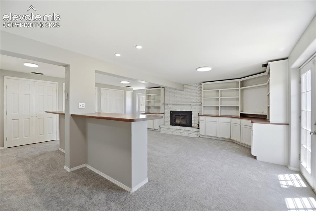 19027 Murphy Road Peyton, CO 80831 - Photo 24 of 48 Carpet, Closets, Built Ins, Fireplace, Dry Bar