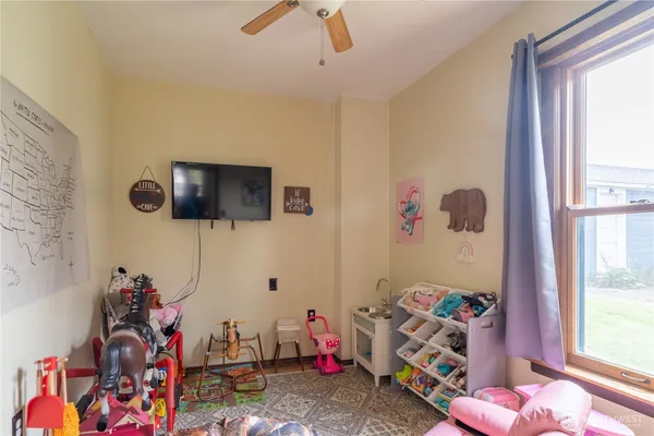 a bedroom with furniture and a window