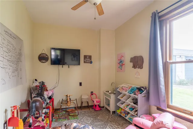 a bedroom with furniture and a window