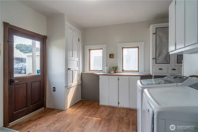 a kitchen with a refrigerator and a sink