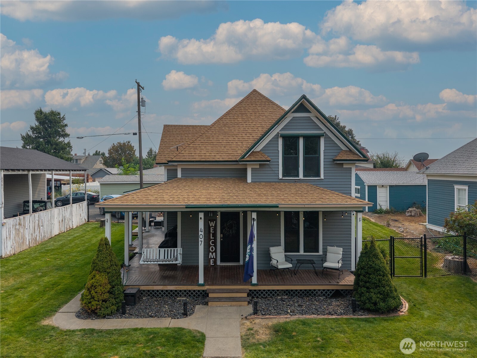 407 West 4th Avenue Ritzville, WA 99169 - Photo 2 of 40 a front view of a house with a yard table and chairs