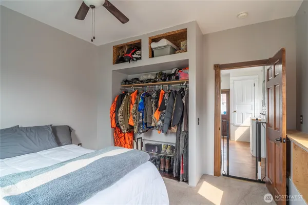 a view of a bedroom with a bed and closet