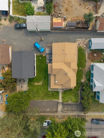 an aerial view of residential houses with outdoor space