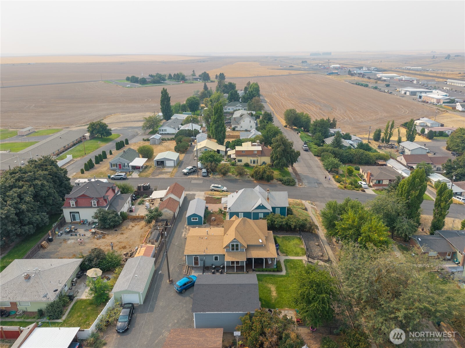 407 West 4th Avenue Ritzville, WA 99169 - Photo 39 of 40 an aerial view of a city with lots of residential buildings ocean and mountain view in back