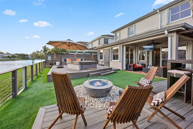 a view of a patio with chairs and a table