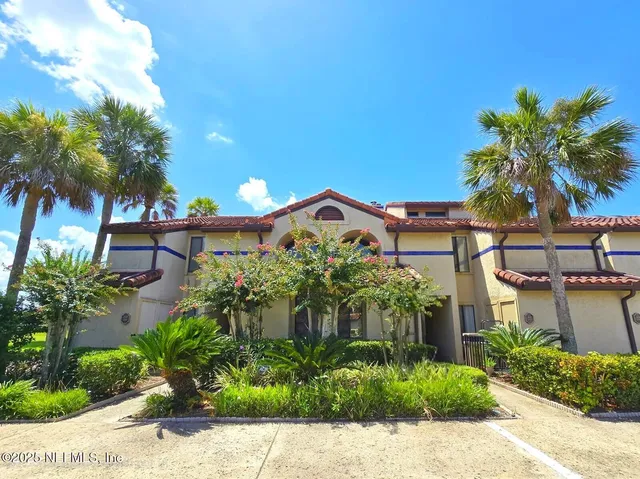 a vase with flowers in front of it