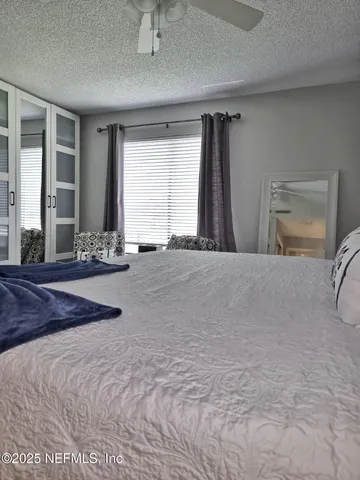 a spacious bathroom with a double vanity sink and a mirror