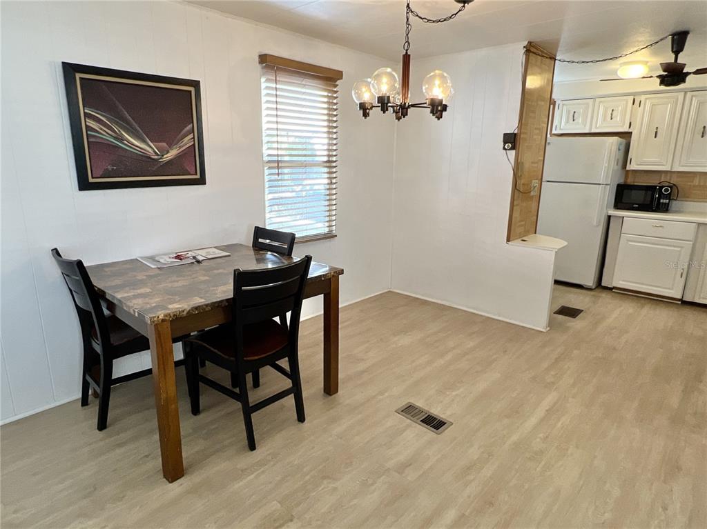 7181 Mt Hawthorne Road Northeast, Unit 590 St. Petersburg, FL 33702 - Photo 7 of 16 a workspace with furniture and window