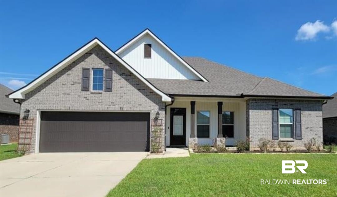 991 Dalton Circle Foley, AL 36535 - Photo 1 of 35 View of front facade featuring concrete driveway, brick siding, and a front lawn