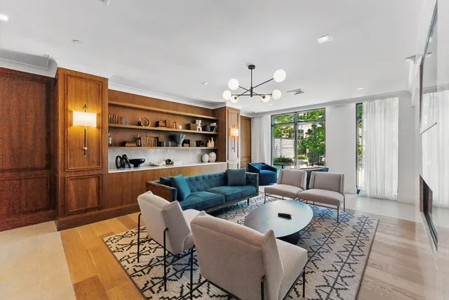 a living room with furniture window and wooden floor