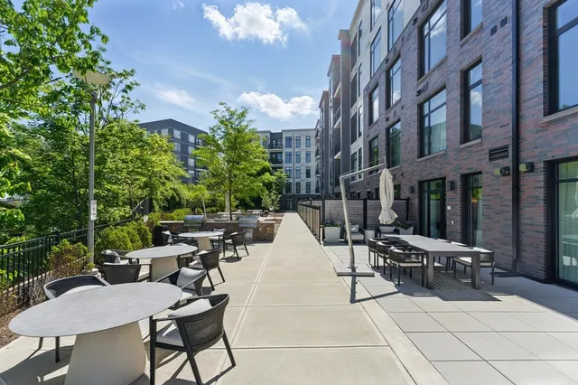 a view of a terrace with furniture and garden