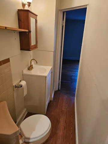 a bathroom with a toilet and a sink