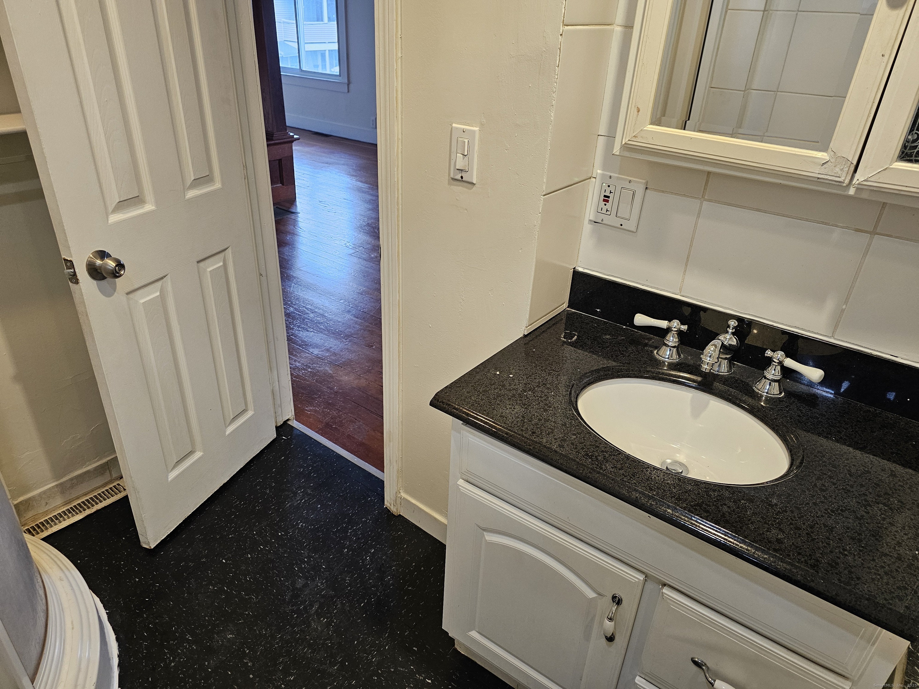 68 New Street Seymour, CT 06483 - Photo 18 of 18 a bathroom with a sink and a mirror
